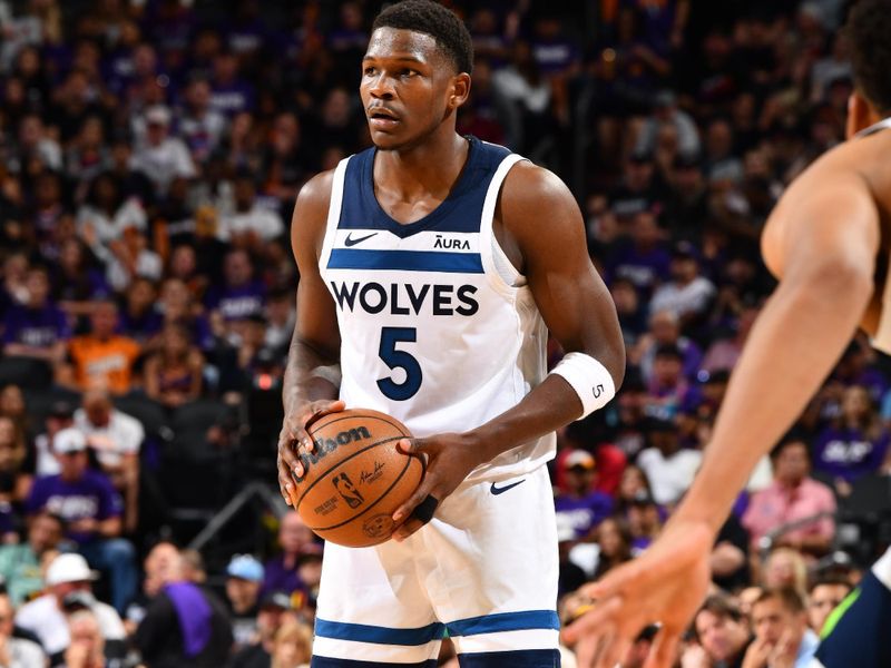 PHOENIX, AZ - APRIL 4: Anthony Edwards #5 of the Minnesota Timberwolves handles the ball during the game against the Phoenix Suns during Round 1 Game 4 of the 2024 NBA Playoffs on April 4, 2023 at Footprint Center in Phoenix, Arizona. NOTE TO USER: User expressly acknowledges and agrees that, by downloading and or using this photograph, user is consenting to the terms and conditions of the Getty Images License Agreement. Mandatory Copyright Notice: Copyright 2024 NBAE (Photo by Barry Gossage/NBAE via Getty Images)