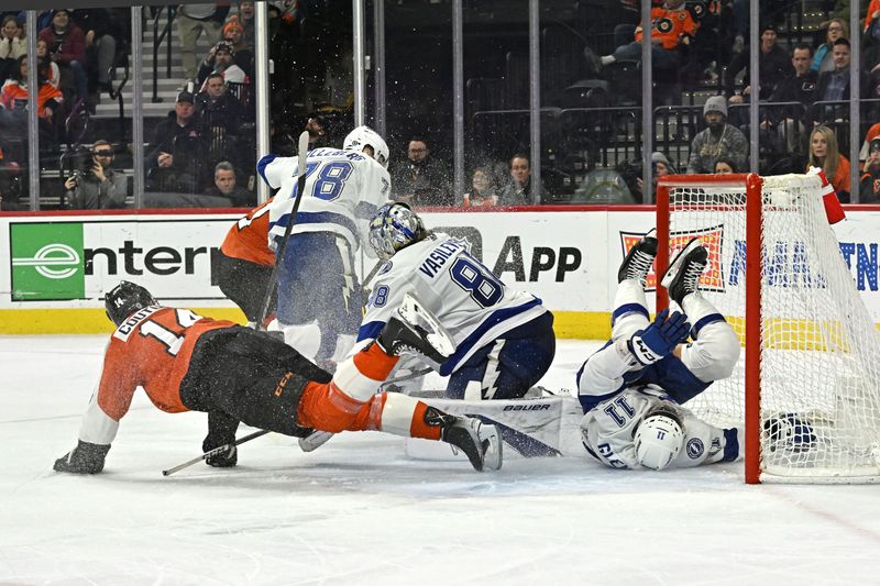 Jan 23, 2024; Philadelphia, Pennsylvania, USA;  Philadelphia Flyers center Sean Couturier (14) and Tampa Bay Lightning center Luke Glendening (11) collide in front of  goaltender Andrei Vasilevskiy (88) during the third period at Wells Fargo Center. Mandatory Credit: Eric Hartline-USA TODAY Sports