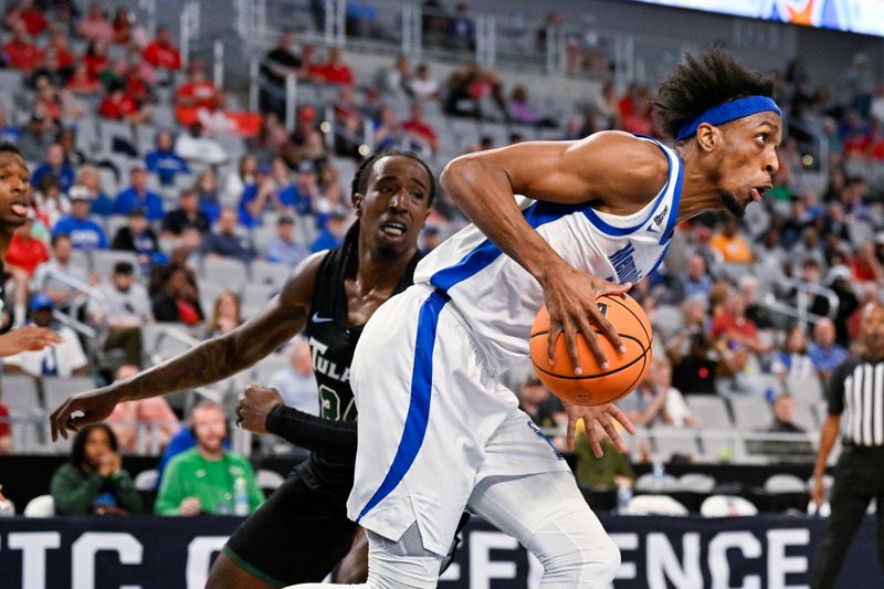 Mar 11, 2023; Fort Worth, TX, USA; Memphis Tigers forward DeAndre Williams (12) drives to the basket past Tulane Green Wave forward Kevin Cross (24) during the first half at Dickies Arena. Mandatory Credit: Jerome Miron-USA TODAY Sports