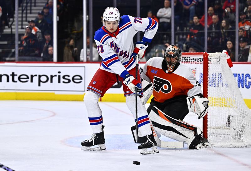 Feb 24, 2024; Philadelphia, Pennsylvania, USA; New York Rangers center Matt Rempe (73) looks to deflect the puck against Philadelphia Flyers goalie Samuel Ersson (33) in the second period at Wells Fargo Center. Mandatory Credit: Kyle Ross-USA TODAY Sports