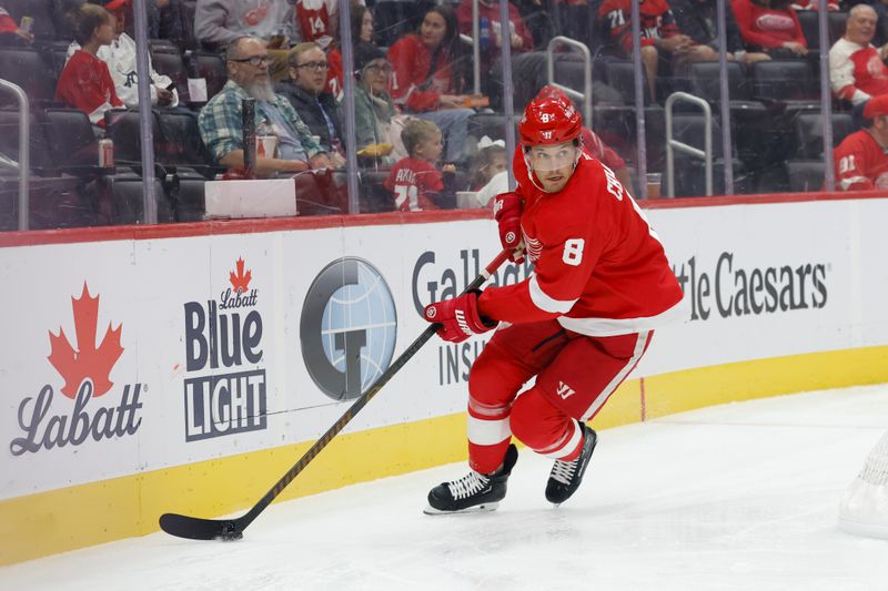 Oct 4, 2024; Detroit, Michigan, USA;  Detroit Red Wings defenseman Ben Chiarot (8) skates with the puck in the first period against the Ottawa Senators at Little Caesars Arena. Mandatory Credit: Rick Osentoski-Imagn Images