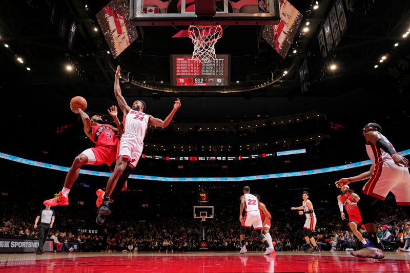 TORONTO, CANADA - JANUARY 17: Immanuel Quickley #5 of the Toronto Raptors drives to the basket during the game against the Miami Heat on January 17, 2024 at the Scotiabank Arena in Toronto, Ontario, Canada.  NOTE TO USER: User expressly acknowledges and agrees that, by downloading and or using this Photograph, user is consenting to the terms and conditions of the Getty Images License Agreement.  Mandatory Copyright Notice: Copyright 2024 NBAE (Photo by Mark Blinch/NBAE via Getty Images)