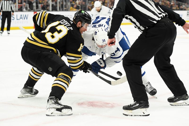 May 4, 2024; Boston, Massachusetts, USA; Boston Bruins center Charlie Coyle (13) and Toronto Maple Leafs center Auston Matthews (34) battle during a face-off in the second period in game seven of the first round of the 2024 Stanley Cup Playoffs at TD Garden. Mandatory Credit: Bob DeChiara-USA TODAY Sports