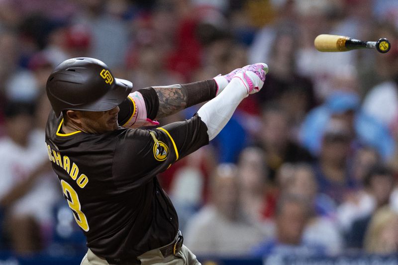 Jun 18, 2024; Philadelphia, Pennsylvania, USA; San Diego Padres third base Manny Machado (13) loose grip on his bat while batting during the ninth inning against the Philadelphia Phillies at Citizens Bank Park. Mandatory Credit: Bill Streicher-USA TODAY Sports