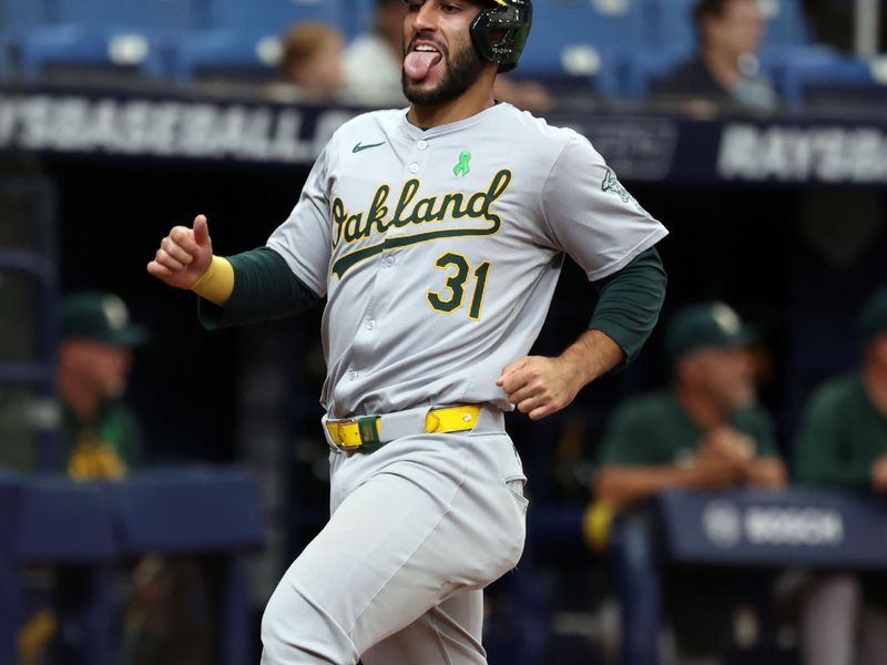 May 30, 2024; St. Petersburg, Florida, USA; Oakland Athletics third baseman Abraham Toro (31) runs home to score a run against the Tampa Bay Rays during the third inning  at Tropicana Field. Mandatory Credit: Kim Klement Neitzel-USA TODAY Sports