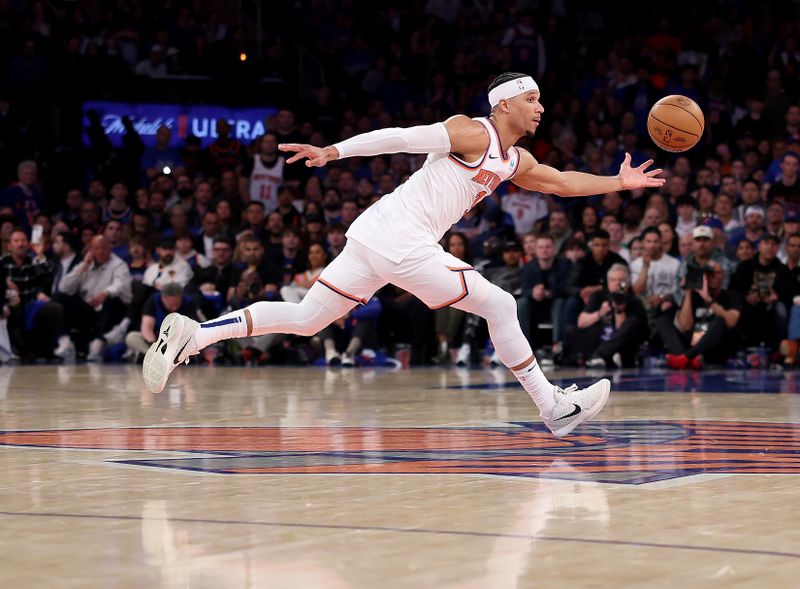 NEW YORK, NEW YORK - APRIL 20: Josh Hart #3 of the New York Knicks grabs the loose ball during the second half against the Philadelphia 76ers in game one of the Eastern Conference First Round Playoffs at Madison Square Garden on April 20, 2024 in New York City. The New York Knicks defeated the Philadelphia 76ers 111-104. NOTE TO USER: User expressly acknowledges and agrees that, by downloading and or using this photograph, User is consenting to the terms and conditions of the Getty Images License Agreement. (Photo by Elsa/Getty Images)