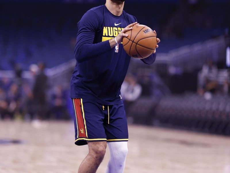 ORLANDO, FLORIDA - FEBRUARY 09: Jamal Murray #27 of the Denver Nuggets warms up prior to the game against the Orlando Magic at Amway Center on February 09, 2023 in Orlando, Florida. NOTE TO USER: User expressly acknowledges and agrees that, by downloading and or using this photograph, User is consenting to the terms and conditions of the Getty Images License Agreement. (Photo by Douglas P. DeFelice/Getty Images)