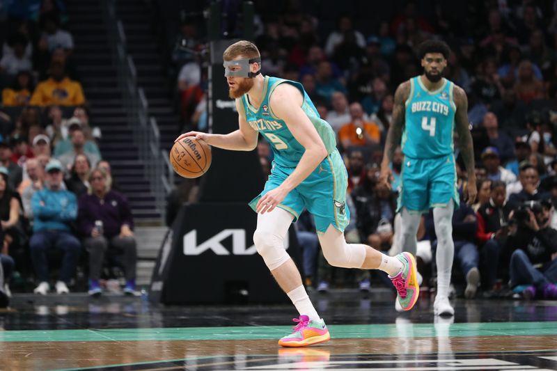 CHARLOTTE, NC - MARCH 29:  Davis Bertans #9 of the Charlotte Hornets handles the ball during the game against the Golden State Warriors on March 29, 2024 at Spectrum Center in Charlotte, North Carolina. NOTE TO USER: User expressly acknowledges and agrees that, by downloading and or using this photograph, User is consenting to the terms and conditions of the Getty Images License Agreement.  Mandatory Copyright Notice:  Copyright 2024 NBAE (Photo by Brock Williams-Smith/NBAE via Getty Images)