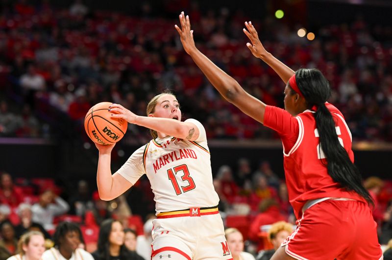 Feb 29, 2024; College Park, Maryland, USA;  Maryland Terrapins guard Faith Masonius (13) looks to pass as Wisconsin Badgers forward Serah Williams (25) defends during the second half at Xfinity Center. Mandatory Credit: Tommy Gilligan-USA TODAY Sports