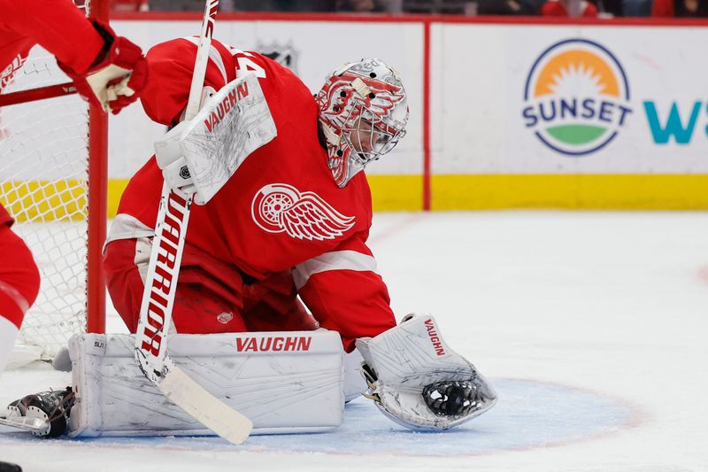 Jan 23, 2024; Detroit, Michigan, USA;  Detroit Red Wings goaltender Alex Lyon (34) makes a save in the first period against the Dallas Stars at Little Caesars Arena. Mandatory Credit: Rick Osentoski-USA TODAY Sports