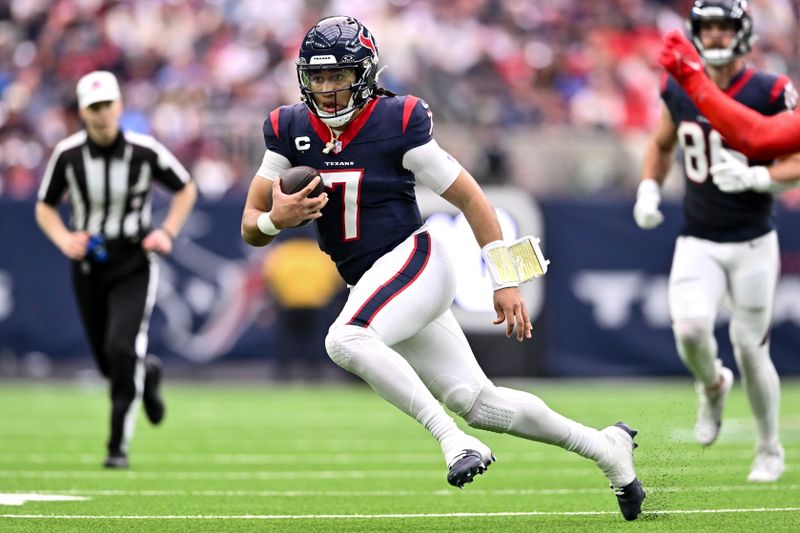 Houston Texans quarterback C.J. Stroud (7) runs the ball in the second quarter against the Tennessee Titans of an NFL football game against the Tennessee Titans, Sunday, Dec 31, 2023, in Houston. (AP Photo/Maria Lysaker)