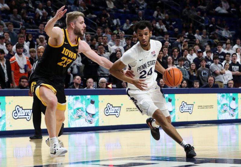 Feb 8, 2024; University Park, Pennsylvania, USA; Penn State Nittany Lions forward Zach Hicks (24) dribbles the ball around Iowa Hawkeyes forward Ben Krikke (23) during the first half at Bryce Jordan Center. Penn State defeated Iowa 89-79. Mandatory Credit: Matthew O'Haren-USA TODAY Sports