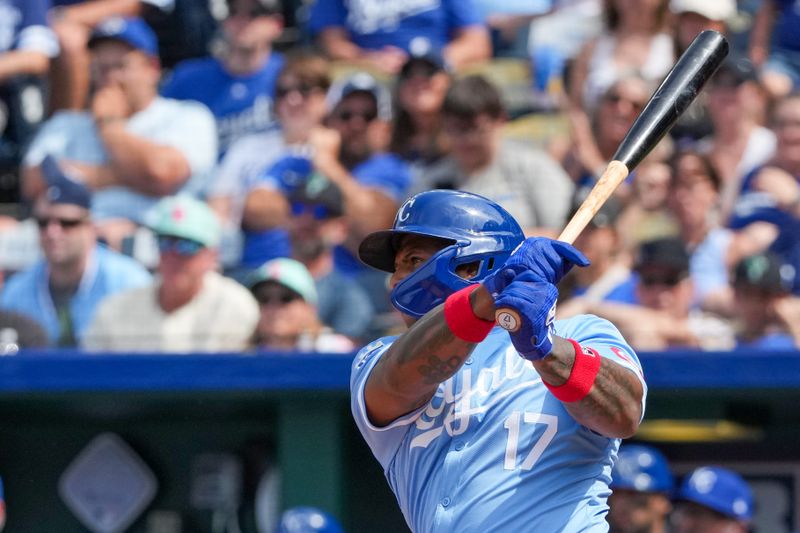 Jun 2, 2024; Kansas City, Missouri, USA; Kansas City Royals outfielder Nelson Velázquez (17) hits a two-run triple against the San Diego Padres in the ninth inning at Kauffman Stadium. Mandatory Credit: Denny Medley-USA TODAY Sports