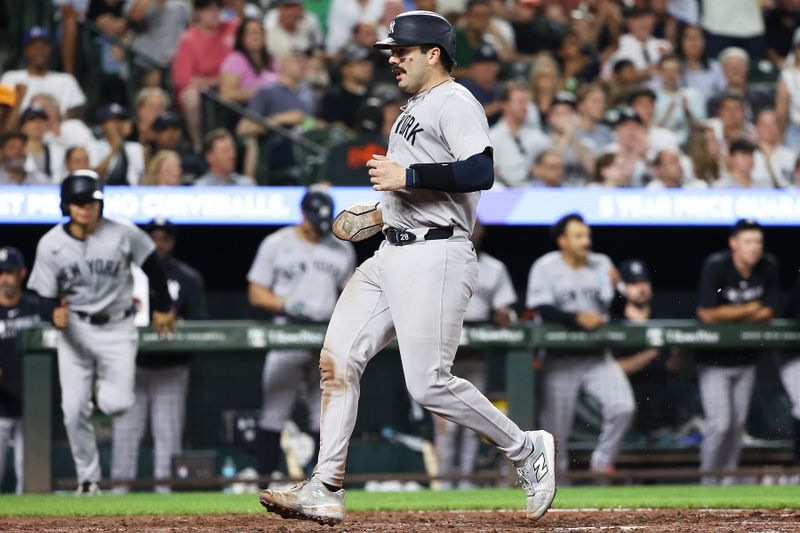 Sep 18, 2025; Baltimore, Maryland, USA; New York Yankees catcher Austin Wells (28) scores during the seventh inning against the Baltimore Orioles at Oriole Park at Camden Yards. Mandatory Credit: Daniel Kucin Jr.-Imagn Images