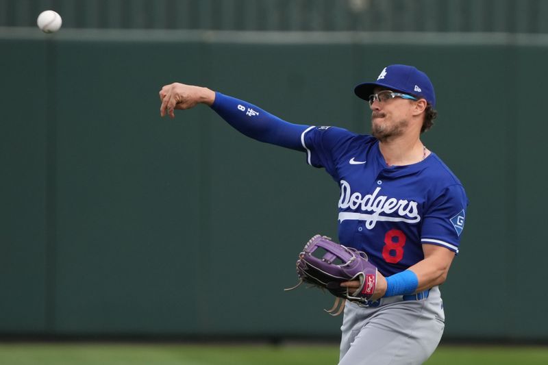 Mar 5, 2025; Tempe, Arizona, USA; Los Angeles Dodgers third base Enrique Hernandez (8) warms up before a game against the Los Angeles Angels at Tempe Diablo Stadium. Mandatory Credit: Rick Scuteri-Imagn Images