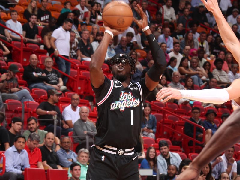 MIAMI, FL - DECEMBER 8: Reggie Jackson #1 of the LA Clippers shoots the ball during the game against the Miami Heat on December 8, 2022 at FTX Arena in Miami, Florida. NOTE TO USER: User expressly acknowledges and agrees that, by downloading and or using this Photograph, user is consenting to the terms and conditions of the Getty Images License Agreement. Mandatory Copyright Notice: Copyright 2022 NBAE (Photo by Issac Baldizon/NBAE via Getty Images)