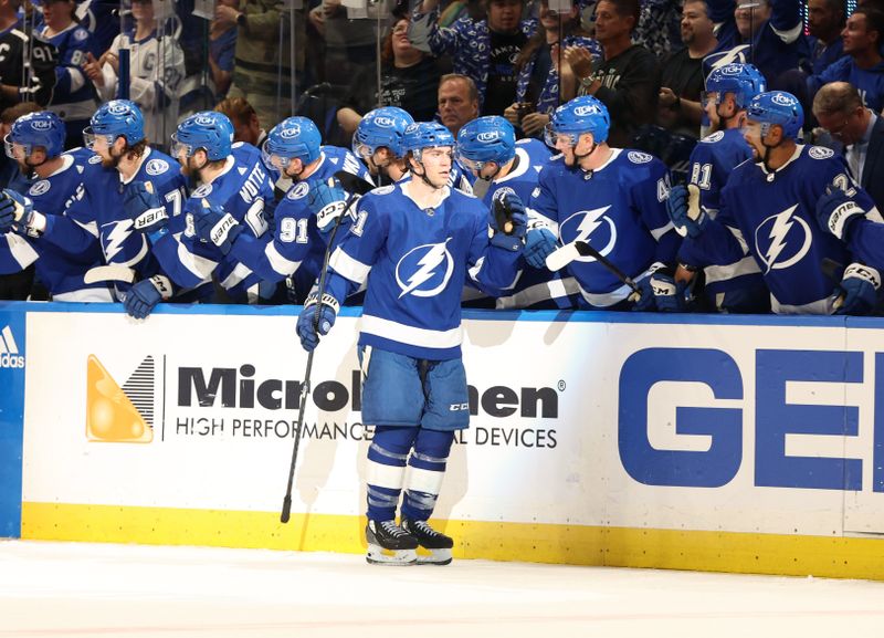 Mar 14, 2024; Tampa, Florida, USA; Tampa Bay Lightning center Brayden Point (21) is congratulated after he scored a goal against the New York Rangers during the second period at Amalie Arena. Mandatory Credit: Kim Klement Neitzel-USA TODAY Sports