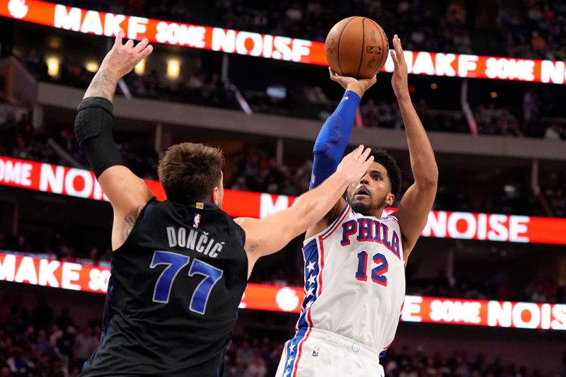 DALLAS, TEXAS - MARCH 03: Tobias Harris #12 of the Philadelphia 76ers is defended by Luka Doncic #77 of the Dallas Mavericks during the first half at American Airlines Center on March 03, 2024 in Dallas, Texas. NOTE TO USER: User expressly acknowledges and agrees that, by downloading and or using this photograph, User is consenting to the terms and conditions of the Getty Images License Agreement. (Photo by Sam Hodde/Getty Images)