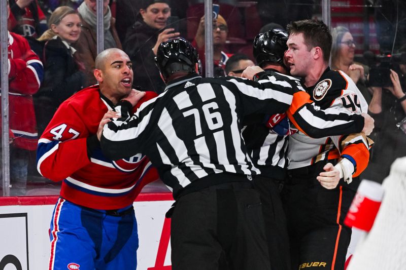 Feb 13, 2024; Montreal, Quebec, CAN; Montreal Canadiens defenseman Jayden Struble (47) exchanges a few words with Anaheim Ducks left wing Ross Johnston (44) during the third period at Bell Centre. Mandatory Credit: David Kirouac-USA TODAY Sports