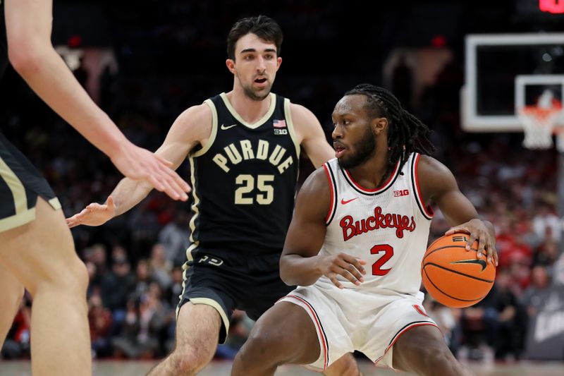 Feb 18, 2024; Columbus, Ohio, USA;  Ohio State Buckeyes guard Bruce Thornton (2) controls the ball as Purdue Boilermakers guard Ethan Morton (25) defends during the second half at Value City Arena. Mandatory Credit: Joseph Maiorana-USA TODAY Sports