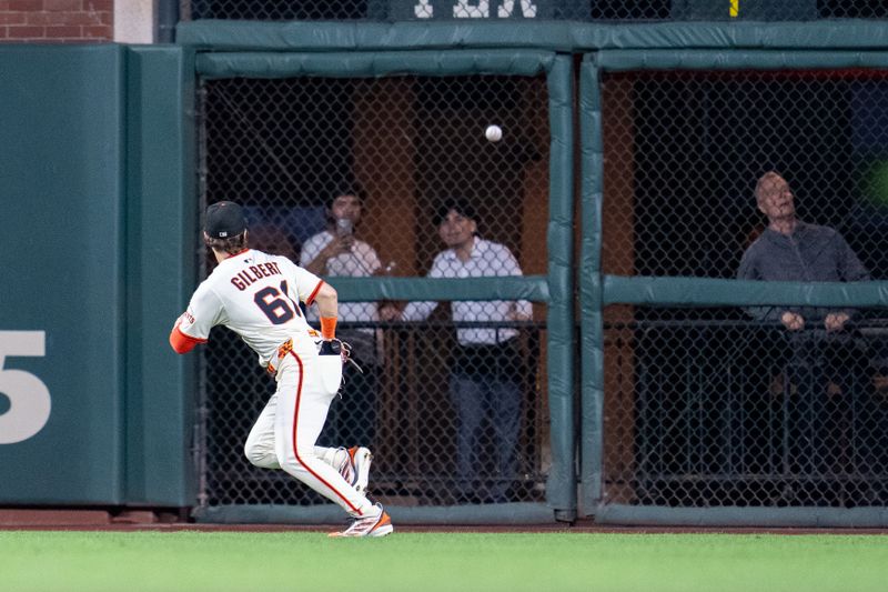 Sep 24, 2025; San Francisco, California, USA; San Francisco Giants right fielder Drew Gilbert (61) chases down an RBI double hit by St. Louis Cardinals second baseman Brendan Donovan (not pictured) during the third inning at Oracle Park. Mandatory Credit: Neville E. Guard-Imagn Images