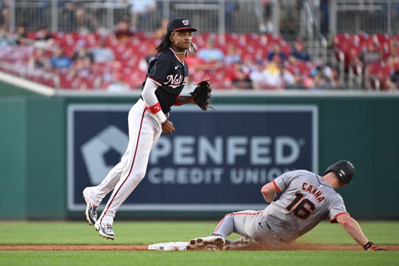 Aug 5, 2024; Washington, District of Columbia, USA; Washington Nationals shortstop CJ Abrams (5) jumps in the air to avoid San Francisco Giants first baseman Mark Canha (16) at second base during the fifth inning at Nationals Park. Mandatory Credit: Rafael Suanes-USA TODAY Sports