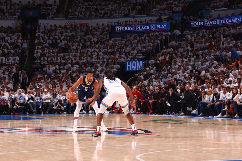 OKLAHOMA CITY, OK - APRIL 21:  CJ McCollum #3 of the New Orleans Pelicans handles the ball during the game  against the Oklahoma City Thunder during Round 1 Game 1 of the 2024 NBA Playoffs on April 21, 2024 at Paycom Arena in Oklahoma City, Oklahoma. NOTE TO USER: User expressly acknowledges and agrees that, by downloading and or using this photograph, User is consenting to the terms and conditions of the Getty Images License Agreement. Mandatory Copyright Notice: Copyright 2024 NBAE (Photo by Zach Beeker/NBAE via Getty Images)