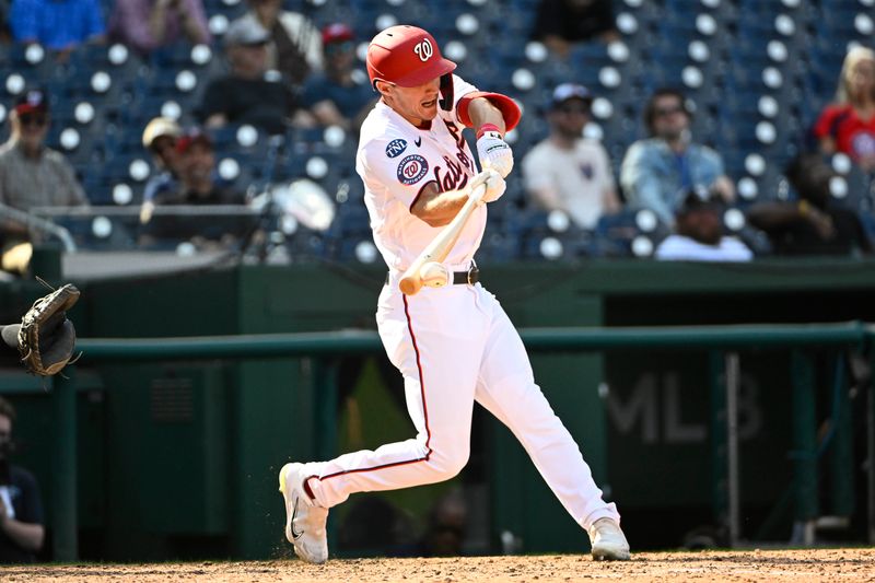 Sep 20, 2023; Washington, District of Columbia, USA; Washington Nationals center fielder Jacob Young (30) hits a RBI single against the Chicago White Sox during the eighth inning at Nationals Park. Mandatory Credit: Brad Mills-USA TODAY Sports