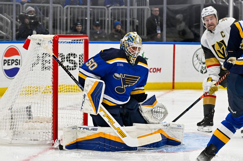 Dec 6, 2023; St. Louis, Missouri, USA;  St. Louis Blues goaltender Jordan Binnington (50) makes a save against the Vegas Golden Knights during the first period at Enterprise Center. Mandatory Credit: Jeff Curry-USA TODAY Sports