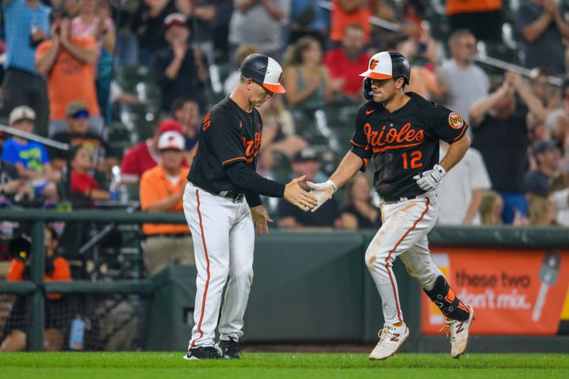 Jun 28, 2023; Baltimore, Maryland, USA; Baltimore Orioles second baseman Adam Frazier (12) rounds the bases after hitting a home run during the eighth inning against the Cincinnati Reds at Oriole Park at Camden Yards. Mandatory Credit: Reggie Hildred-USA TODAY Sports