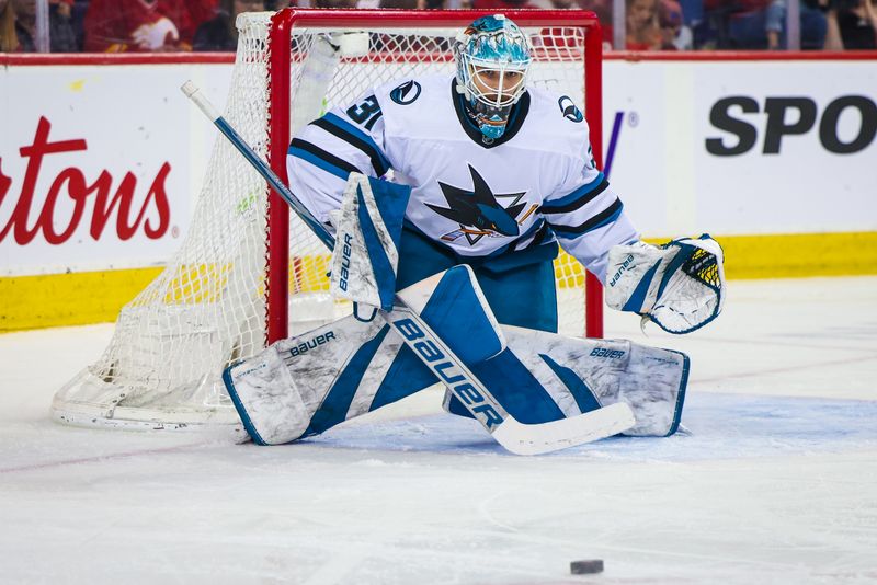 Apr 18, 2024; Calgary, Alberta, CAN; San Jose Sharks goaltender Georgi Romanov (31) guards his net against the Calgary Flames during the second period at Scotiabank Saddledome. Mandatory Credit: Sergei Belski-USA TODAY Sports