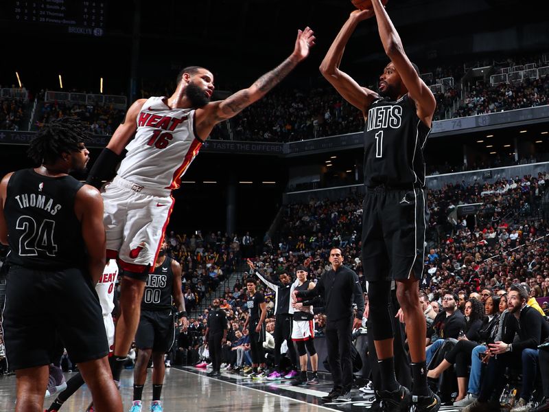 BROOKLYN, NY - JANUARY 15: Mikal Bridges #1 of the Brooklyn Nets shoots the ball during the game against the Miami Heat on January 15, 2024 at Barclays Center in Brooklyn, New York. NOTE TO USER: User expressly acknowledges and agrees that, by downloading and or using this Photograph, user is consenting to the terms and conditions of the Getty Images License Agreement. Mandatory Copyright Notice: Copyright 2024 NBAE (Photo by David Nemec/NBAE via Getty Images)