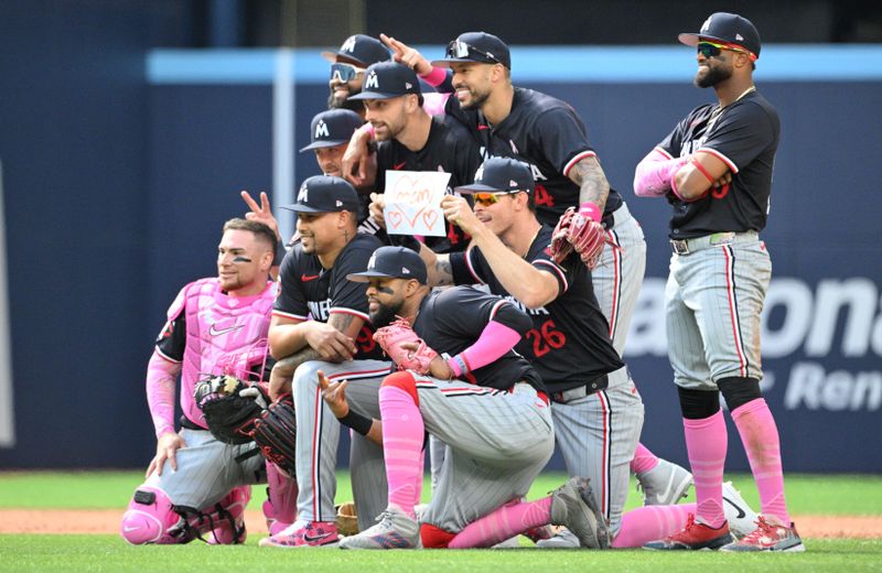 May 12, 2024; Toronto, Ontario, CAN;  Minnesota Twins players pose for a group photo after defeating the Toronto Blue Jays at Rogers Centre. Mandatory Credit: Dan Hamilton-USA TODAY Sports