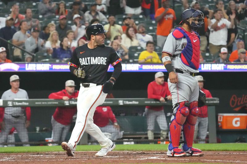 May 16, 2025; Baltimore, Maryland, USA; Baltimore Orioles outfielder Ramon Laureano (12) scores a run during the third inning against the Washington Nationals at Oriole Park at Camden Yards. Mandatory Credit: Mitch Stringer-Imagn Images