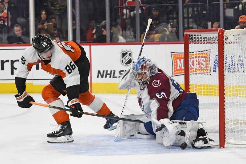 Nov 18, 2024; Philadelphia, Pennsylvania, USA; Colorado Avalanche goaltender Justus Annunen (60) makes a save against Philadelphia Flyers left wing Joel Farabee (86) during the first period at Wells Fargo Center. Mandatory Credit: Eric Hartline-Imagn Images