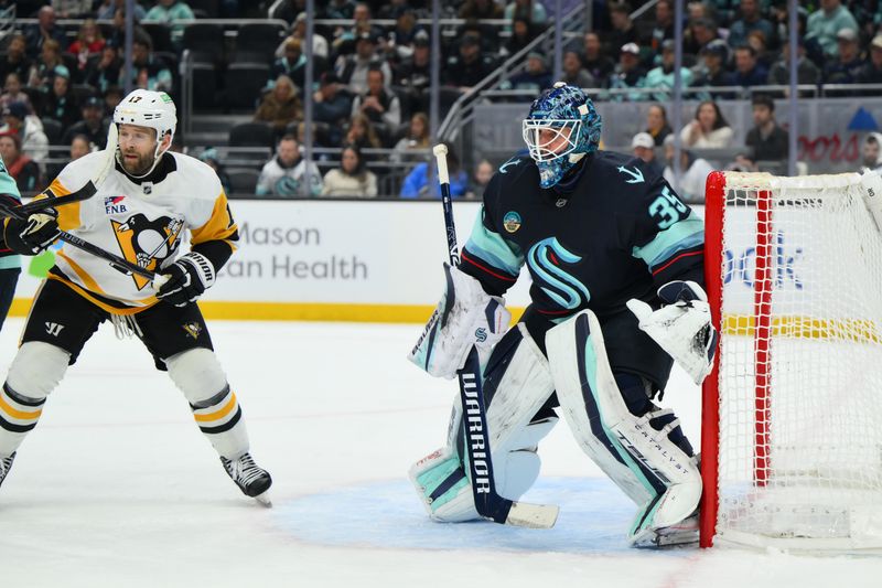 Jan 19, 2026; Seattle, Washington, USA; Seattle Kraken goaltender Joey Daccord (35) defends the goal against the Pittsburgh Penguins during the second period at Climate Pledge Arena. Mandatory Credit: Steven Bisig-Imagn Images