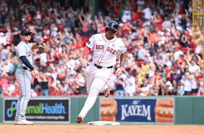 Jun 2, 2024; Boston, Massachusetts, USA;  Boston Red Sox third baseman Rafael Devers (11) runs the bases after hitting a home run against the Detroit Tigers during the eighth inning at Fenway Park. Mandatory Credit: Eric Canha-USA TODAY Sports