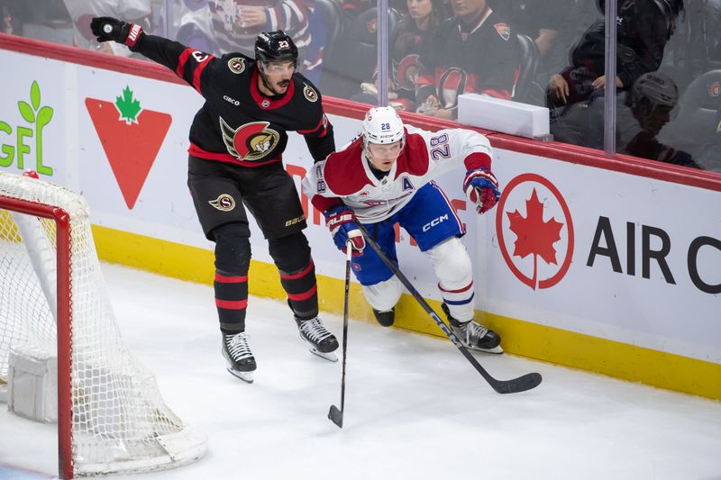 Oct 5, 2024; Ottawa, Ontario, CAN; Ottawa Senators defenseman Travis Hamonic (23) and Montreal Canadiens center Christian Dvorak (28) chase the puck in the third period at the Canadian Tire Centre. Mandatory Credit: Marc DesRosiers-Imagn Images