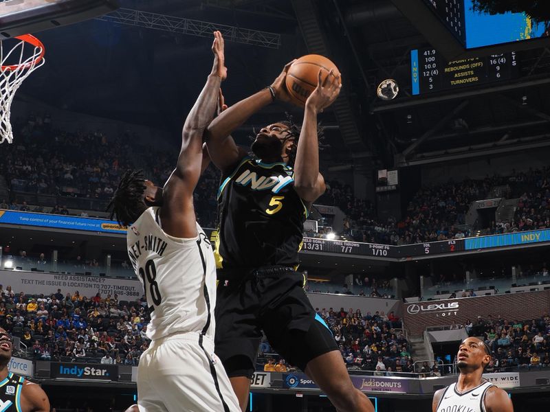 INDIANAPOLIS, IN - MARCH 16: Jarace Walker #5 of the Indiana Pacers drives to the basket during the game against the Brooklyn Nets on March 16, 2024 at Gainbridge Fieldhouse in Indianapolis, Indiana. NOTE TO USER: User expressly acknowledges and agrees that, by downloading and or using this Photograph, user is consenting to the terms and conditions of the Getty Images License Agreement. Mandatory Copyright Notice: Copyright 2024 NBAE (Photo by Ron Hoskins/NBAE via Getty Images)