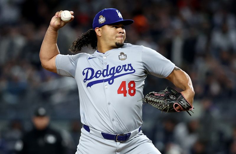 Oct 28, 2024; New York, New York, USA; Los Angeles Dodgers pitcher Brusdar Graterol (48) throws during the sixth inning against the New York Yankees in game three of the 2024 MLB World Series at Yankee Stadium. Mandatory Credit: Wendell Cruz-Imagn Images