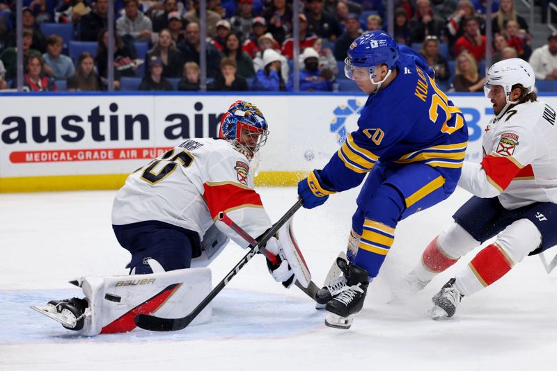 Oct 12, 2024; Buffalo, New York, USA;  Florida Panthers goaltender Spencer Knight (30) makes a pad save on Buffalo Sabres center Jiri Kulich (20) during the second period at KeyBank Center. Mandatory Credit: Timothy T. Ludwig-Imagn Images