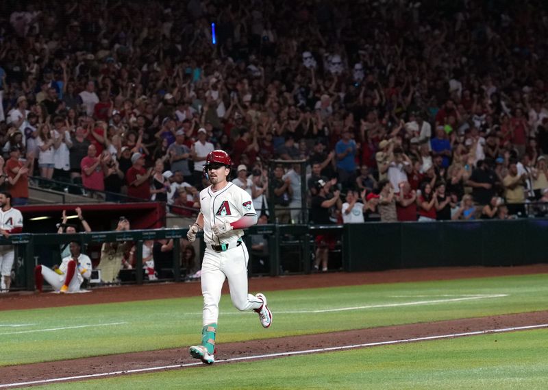 Jul 13, 2024; Phoenix, Arizona, USA; Arizona Diamondbacks outfielder Corbin Carroll (7) runs the bases after hitting a three run home run against the Toronto Blue Jays during the seventh inning at Chase Field. Mandatory Credit: Joe Camporeale-USA TODAY Sports