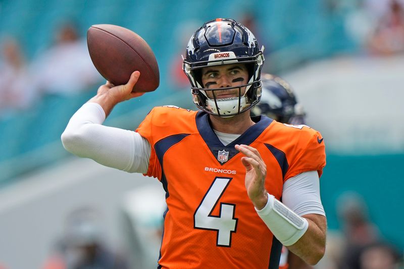 Denver Broncos quarterback Jarrett Stidham warms up before the start of an NFL football game against the Miami Dolphins, Sunday, Sept. 24, 2023, in Miami Gardens, Fla. (AP Photo/Wilfredo Lee)