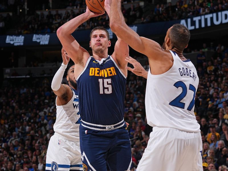 DENVER, CO - APRIL 10:  Nikola Jokic #15 of the Denver Nuggets shoots the ball during the game against the Minnesota Timberwolves on April 10, 2024 at the Ball Arena in Denver, Colorado. NOTE TO USER: User expressly acknowledges and agrees that, by downloading and/or using this Photograph, user is consenting to the terms and conditions of the Getty Images License Agreement. Mandatory Copyright Notice: Copyright 2024 NBAE (Photo by Bart Young/NBAE via Getty Images)