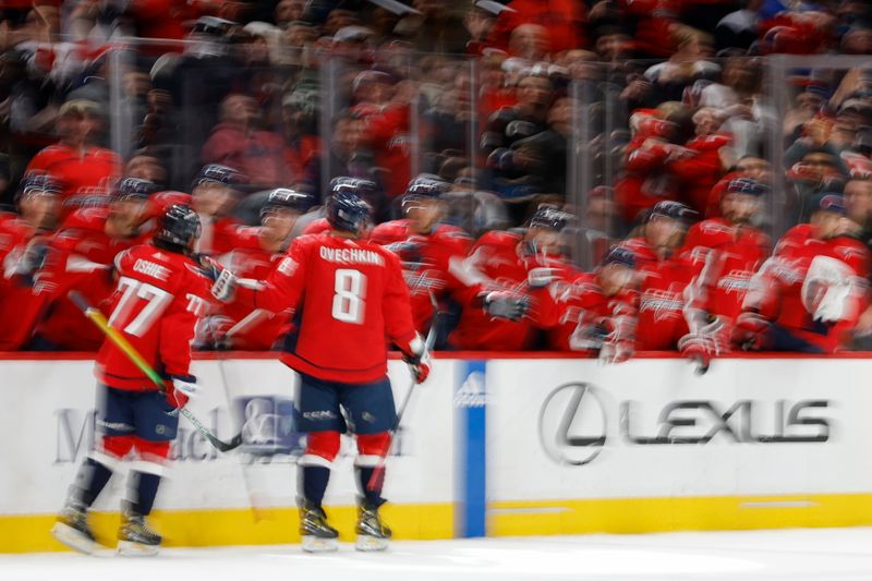 Feb 13, 2024; Washington, District of Columbia, USA; Washington Capitals left wing Alex Ovechkin (8) celebrates with teammates after scoring a goal against the Colorado Avalanche in the third period at Capital One Arena. Mandatory Credit: Geoff Burke-USA TODAY Sports