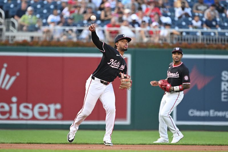 Aug 28, 2024; Washington, District of Columbia, USA; Washington Nationals third baseman Jose Tena (8) attempts a throw to first base against the New York Yankees during the first inning at Nationals Park. Mandatory Credit: Rafael Suanes-USA TODAY Sports