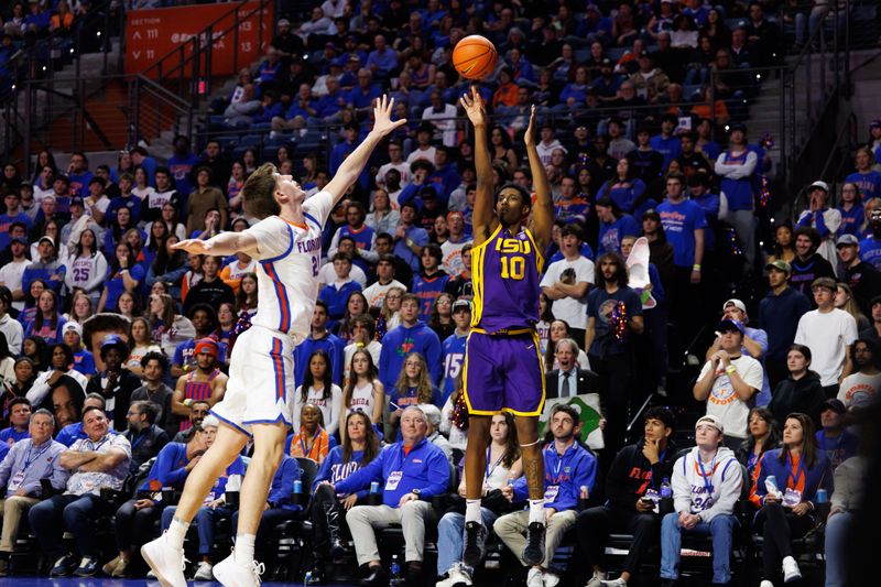 Jan 20, 2026; Gainesville, Florida, USA; Louisiana State Tigers forward Marquel Sutton (10) attempts a three point basket over Florida Gators forward Alex Condon (21) during the first half at Exactech Arena at the Stephen C. O'Connell Center. Mandatory Credit: Matt Pendleton-Imagn Images