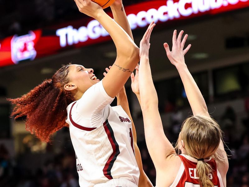 Jan 22, 2023; Columbia, South Carolina, USA; South Carolina Gamecocks center Kamilla Cardoso (10) shoots over Arkansas Razorbacks forward Emrie Ellis (55) in the second half at Colonial Life Arena. Mandatory Credit: Jeff Blake-USA TODAY Sports