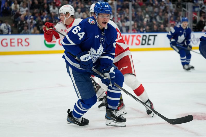 Nov 8, 2024; Toronto, Ontario, CAN; Toronto Maple Leafs forward David Kampf (64) skates against the Detroit Red Wings during the second period at Scotiabank Arena. Mandatory Credit: John E. Sokolowski-Imagn Images