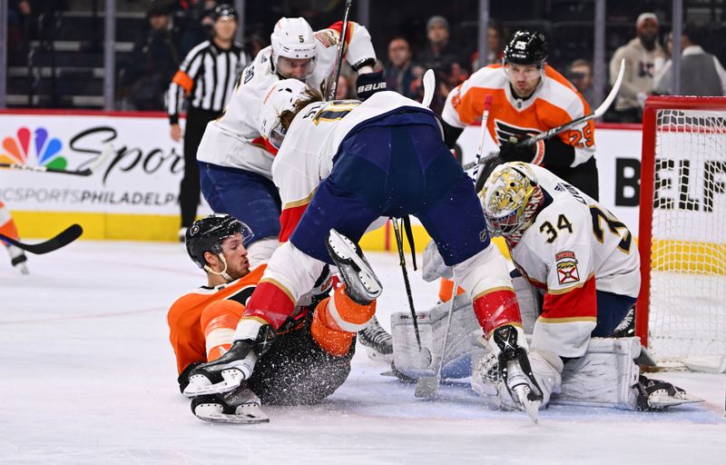 Mar 21, 2023; Philadelphia, Pennsylvania, USA; Florida Panthers defenseman Marc Staal (18) hits Philadelphia Flyers left wing Joel Farabee (86) as Florida Panthers goalie Alex Lyon (34) covers the puck in the first period at Wells Fargo Center. Mandatory Credit: Kyle Ross-USA TODAY Sports